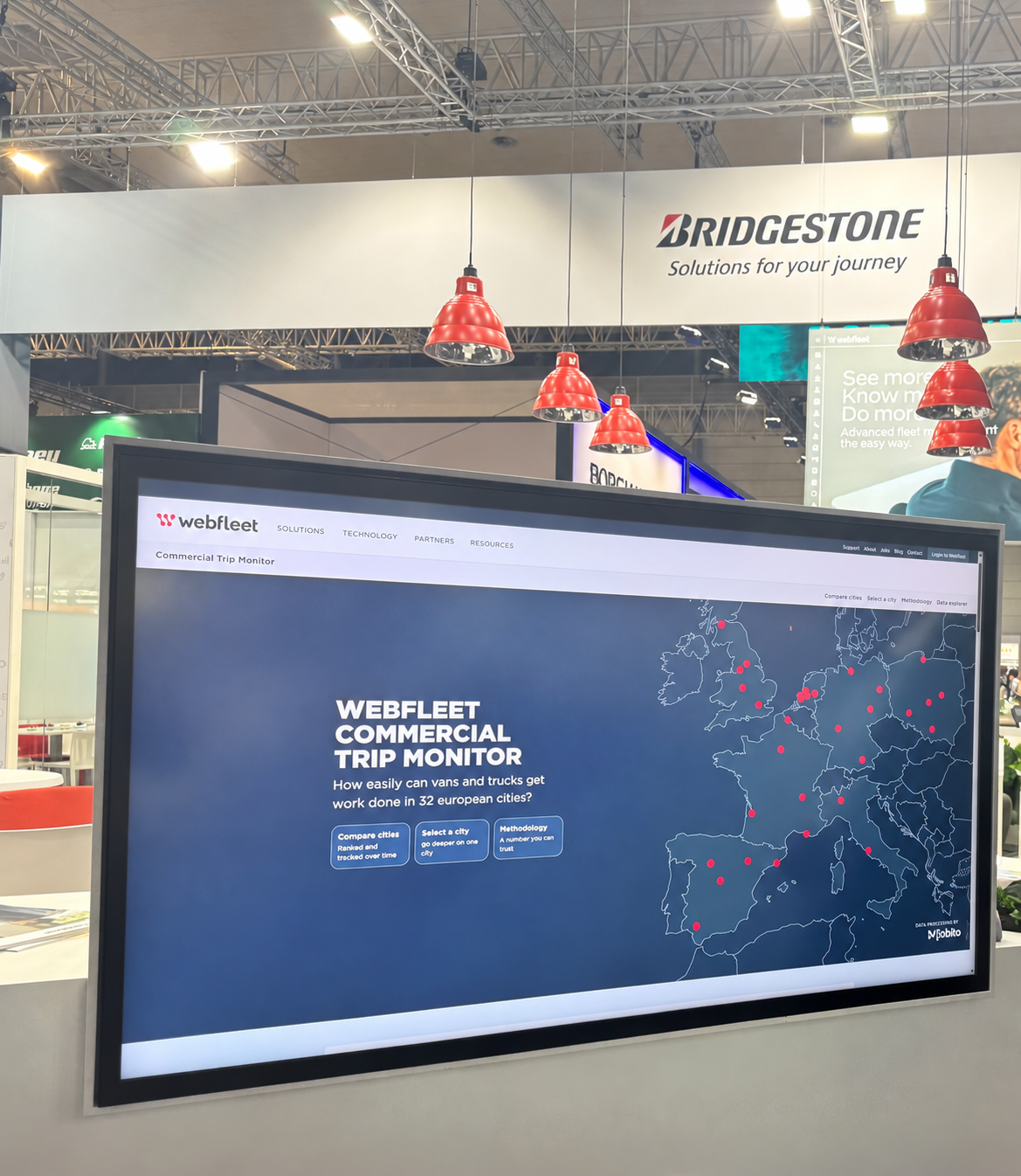 The Webfleet Commercial Trip Monitor displayed on a screen at the Bridgestone stand, IAA Transportation 2026